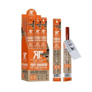 Boxed display of Righteous Felon Fiery Habanero beef sticks with multiple orange-wrapped packages and individual sticks showing the FIERY HABANERO label; bold branding visible on packaging.
