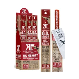 Packaging display for Righteous Felon O.G. Hickory beef sticks (savory & smoky) in red/tan boxes, with a single jerky stick shown on the right and multiple boxes in a standee.