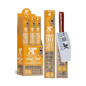 Display of Righteous Felon Street Taco Inspired pork jerky sticks in orange packaging and box.